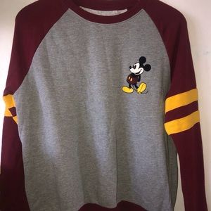 Mickey Mouse Disney sweatshirt. Grey with maroon sleeves and yellow stripes.